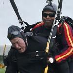 Former president George H. W. Bush made a tandem jump with a retired member of the Army?s parachute team in Maine.