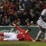 Brock Holt slides across the plate while scoring on a Dustin Pedroia double in the seventh inning. (Barry Chin/Globe Staff) 