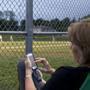 Patty Andresino caught up on her Facebook page while her son, Joe, played for Sullivan Insurance in the Milton Little League playoffs.