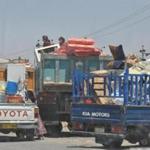 Families leave the village of Taza Khormato, south of the oil hub city of Kirkuk in northern Iraq, fearing any escalation in fighting reaching their village.