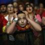 A Spanish soccer fan watching the game from Madrid can?t hide her disappointment. AP Photo/Andres Kudacki