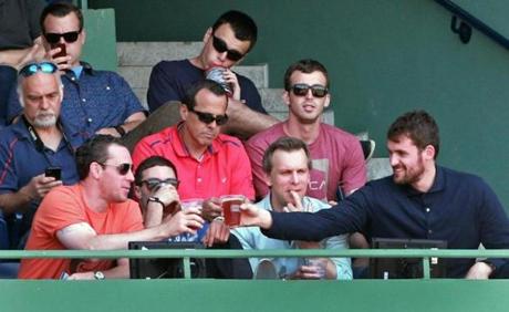 Timberwolves star Kevin Love (far right) took in a game at Fenway Park earlier this month. (Jim Davis/Globe Staff)
