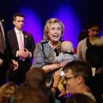 Former Secretary of State Hillary Rodham Clinton looked surprised as she was handed a baby during a stop on her book tour at George Washington University.