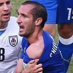 Luis Suarez apparently bit the shoulder of Italy defender Giorgio Chiellini (pictured) as the pair clashed in the Italian penalty area.