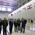 Russian Prime Minister Dmitry Medvedev, third from the right, visited an assembly shop with the Angara booster rocket in February. 