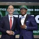 Marcus Smart, pictured with commissioner Adam Silver, provides the Celtics with versatility in the backcourt.  EPA/JASON SZENES