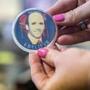An employee held a button in support of former CEO Arthur T. Demoulas at Indian Ridge Country Club in Andover.