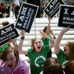 Antiabortion advocates cheered in front of the Supreme Court after the decision was announced on Monday.