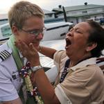 Matthew Guthmiller is greeted by a wellwisher has he disembarks from his plane after landing in Manila on Monday.