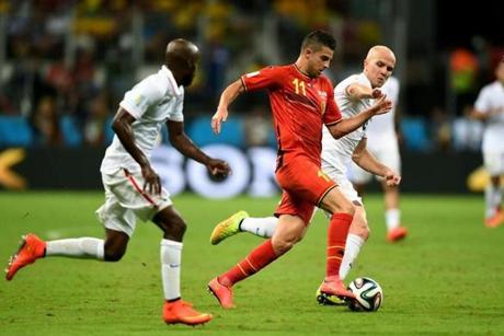 Kevin Mirallas of Belgium controled the ball as Michael Bradley of the US gave chase.
