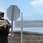 US Border patrol agents kept watch outside the entrance to the US Border Patrol facility in Murrieta, California. 