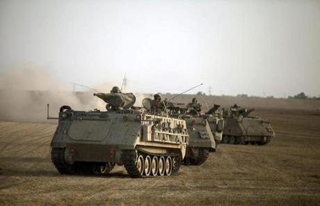 Israeli armored personnel carriers were in position near the Gaza border.
