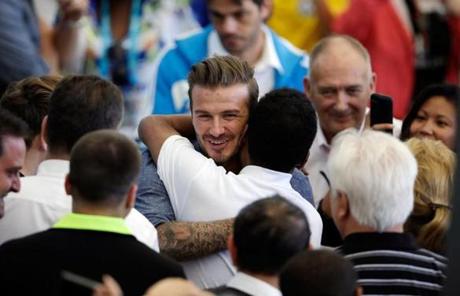 Former English player David Beckham greeted Brazilian soccer legend Pele.
