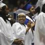 Yonetta Harris, (center), 18, a three-sport athlete, graduated from O?Bryant High School on June 13.