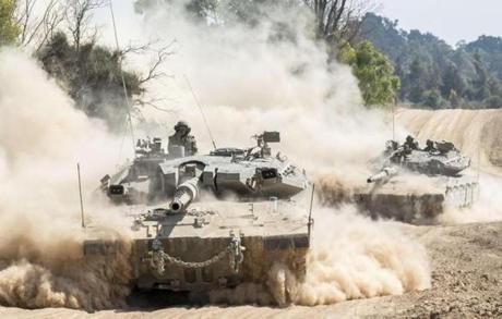 Israeli Merkava tanks moved near Israel's border with Gaza Sunday.
