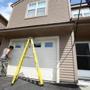Jim and Teresa Anapol left a four-bedroom house in Stow for the convenience of a condo, It?s getting a new garage door. 
