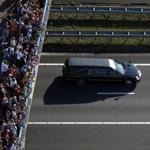 Mourners watched as a convoy of hearses passed Wednesday containing victims of the Malaysia Airlines Flight 17 crash.