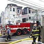 A nine-alarm fire in the densely populated Cambridgeport neighborhood spread to three apartment buildings early on Sunday morning.