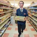 Grocery clerk Tom Glynn stocked shelves Monday with non-perishable items from the first delivery in nine days at the central Haverhill Market Basket. 