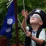 Hudson Wynne, 4, of Beverly, joins a contest at the New England Pirate Faire in Salem.