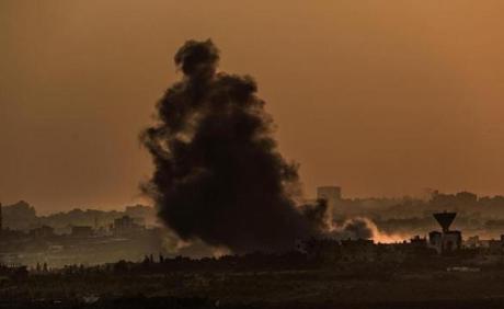 Smoke rose as a result of Israeli airstrike from a northern Gaza Strip neighborhood Monday. 
