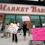 Market Basket workers picketed at the company?s distribution center in Andover, where a job fair was held on Monday. Some part-time workers hurt by the dispute have been hired by rival Hannaford. 