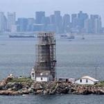  Scaffolding envelops Boston Light on Little Brewster Island as workers renovate the structure and surrounding buildings. The tower was rebuilt in 1783 after the British blew up the original in the Revolutionary War.
