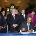 Governor Deval Patrick signs a bill intended to reduce gun violence.