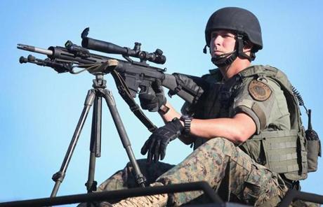 An officer with a high-powered weapon was in Ferguson.
