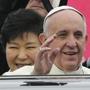 Pope Francis waved Thursday upon his arrival at Seoul Air Base in Seongnam, South Korea. 
