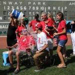 Julie Frates, wife of Peter Frates, dumps a bucket of ice water on her husband in a brief ceremony where Frates issued a challenge to President Obama and two others. 