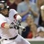 Dustin Pedroia lines a two-run ground-rule double to right field during the sixth inning. (AP Photo/Charles Krupa)