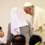 Pope Francis visited with a boy at the House of Hope center in Kkottongae, South Korea, on Saturday.