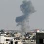 Smoke was seen after what witnesses said was an Israeli air strike in Gaza City on Tuesday.