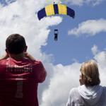 Spectators watched skydivers through cameras and binoculars at Jumptown in Orange.