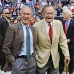 Former Presidents George H. W. Bush, right, and George W. Bush. 