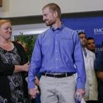 Dr. Kent Brantly (center) is one of two Americans who was discharged from an Atlanta hospital after receiving an experimental drug to treat the Ebola virus they contracted while working in West Africa.