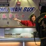A worker at the Fung Wah Bus ticket booth at South Station sold passengers tickets for a bus headed to New York. 
