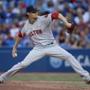 Clay Buchholz delivers against the Blue Jays in Toronto. Tom Szczerbowski/Getty Images