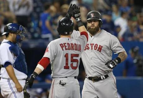 Mike Napoli hit a three-run home run in the 11th inning, part of a seven-run outburst.
