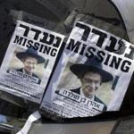 Posters showing a picture of Aharon Sofer were on display as volunteers searched for him. Authorities said a body believed to be Sofer has been found.