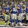 The Giants congratulated Peyton Hillis after he scored a touchdown against the Patriots.