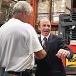 Arthur T. Demoulas (center) thanked workers in the warehouse at Market Basket?s headquarters in Tewksbury on Thursday.