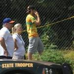 Spectators at the scene of a small airplane crash that killed two people in North Hampton, N.H.