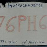 A Springfield woman attempted to replicate a Mass. license plate with cardboard and colored pencils.