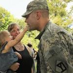 Sergeant Justin George said goodbye to his daughter, Teagan, 15 months, and wife, Colby, following a deployment ceremony near the Old North Bridge Saturday.