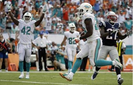 Miami running back Lamar Miller ran the ball for a touchdown during the second half.
