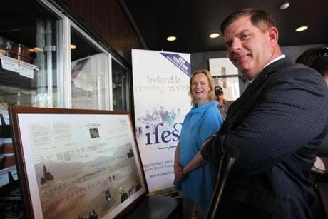 Martin Walsh was given a framed genealogist report on his family heritage by Rachel Kelly, the founder of ifest, an Irish festival that is coming to Boston.   
