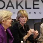 Martha Coakley, center, spoke during a roundtable discussion in Boston Sunday with US Sen. Elizabeth Warren (left) and US Sen. Kirsten Gillibrand of N.Y. (AP Photo) 