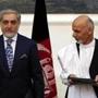 Rival presidential candidates Abdullah Abdullah, left, and Ashraf Ghani stood together after exchanging signed agreements for the country's unity government in Kabul Sunday.